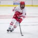 Caroline Harvey carries the puck for the University of Wisconsin women's hockey team