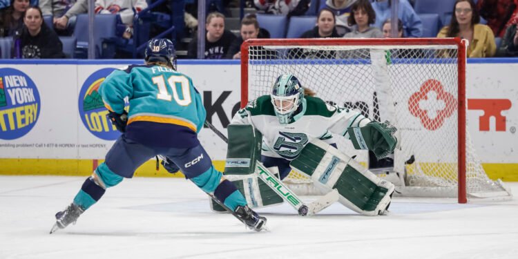 Aerin Frankel of the Boston Fleet watches New York Sirens forward Sarah Fillier approach in the shootout