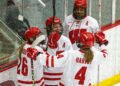 Lacey Eden, Casey O'Brien, Laila Edwards, and Caroline Harvey celebrate a Wisconsin goal