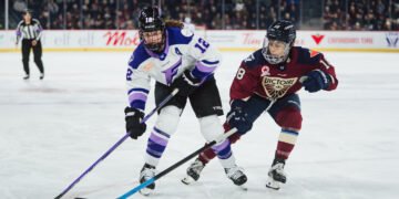 Kelly Pannek carries the puck for the Minnesota Frost