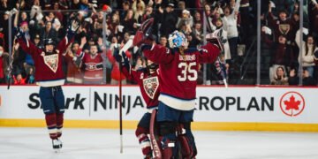 Ann-Renee Desbiens celebrates the win with her teammates