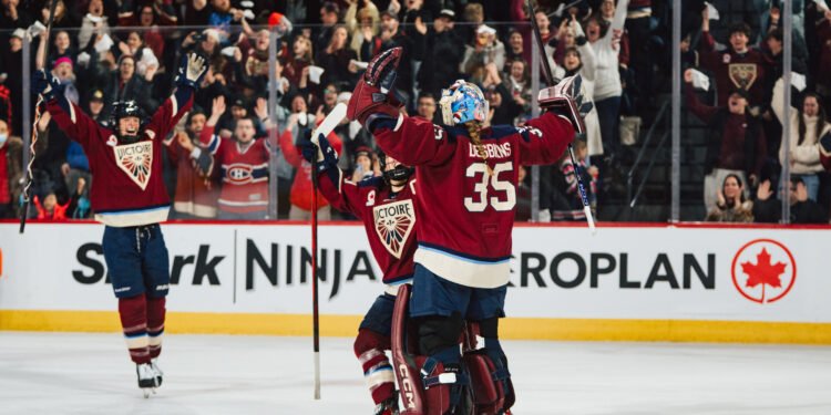Ann-Renee Desbiens celebrates the win with her teammates