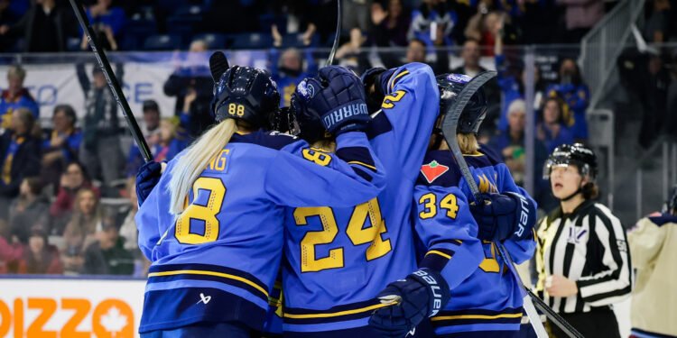Natalie Spooner and her teammates celebrate