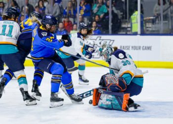 Natalie Spooner crashes the net for the Toronto Sceptres as New York Sirens goaltender Corinne Schroeder turns aside a shot - Photo @ PWHL