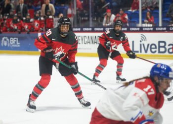Sarah Nurse and Marie-Philip Poulin watch the play with Canada against Czechia at the 2024 World Championships - Photo @ Ellen Bond