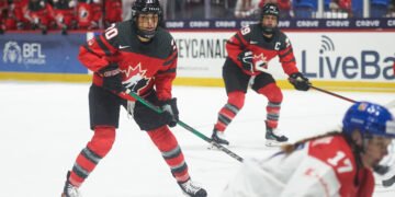 Sarah Nurse and Marie-Philip Poulin watch the play with Canada against Czechia at the 2024 World Championships - Photo @ Ellen Bond