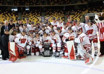 The Wisconsin Badgers women's hockey team celebrates their 2025 WCHA title. They enter the 2025 NCAA women's hockey national championships as the top seed - Photo @ Wisconsin Athletics