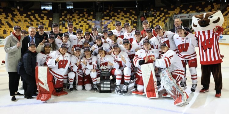 The Wisconsin Badgers women's hockey team celebrates their 2025 WCHA title. They enter the 2025 NCAA women's hockey national championships as the top seed - Photo @ Wisconsin Athletics