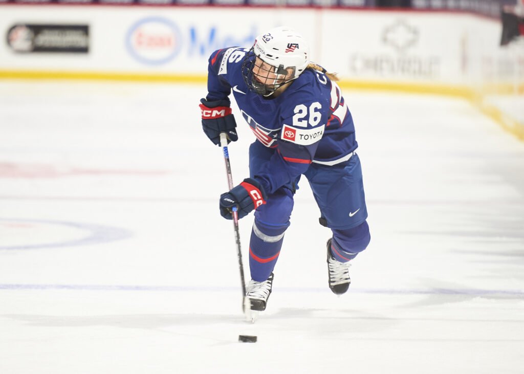 Kendall Coyne Schofield carries the puck down the ice for Team USA - Photo @ Ellen Bond