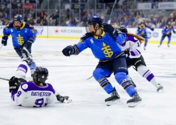 Natalie Spooner watches the play with a sprawling Mae Batherson on the ice - Photo @ PWHL