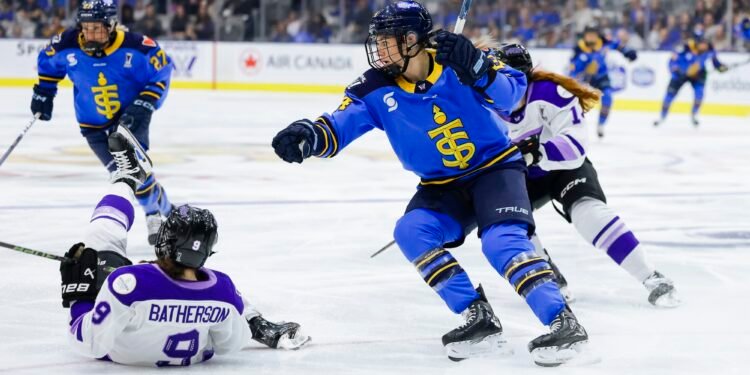 Natalie Spooner watches the play with a sprawling Mae Batherson on the ice - Photo @ PWHL